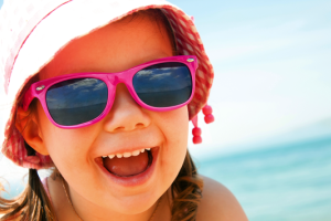 girl-sunglasses-hat-beach-1200x630